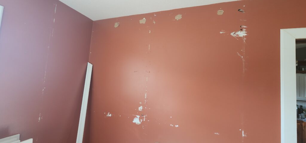 wall with holes after cabinet removal
