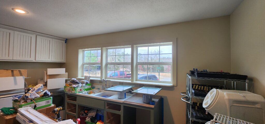 laundry room cabinets removed and paint drying