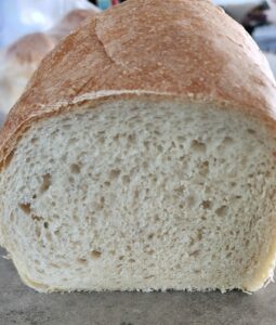 cut loaf of sourdough bread with crumb view