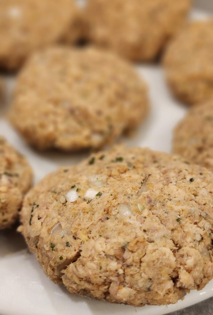 raw salmon cakes on plate