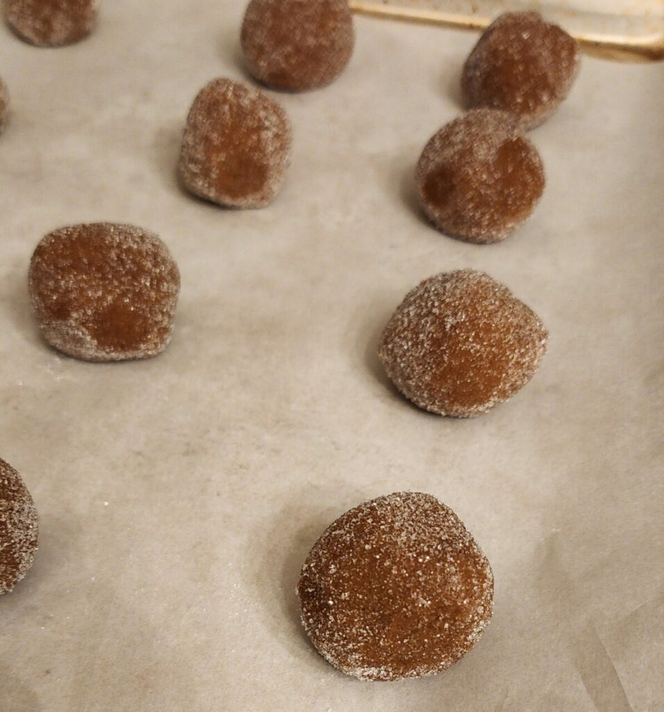 Ginger molasses cookie dough balls prior to baking